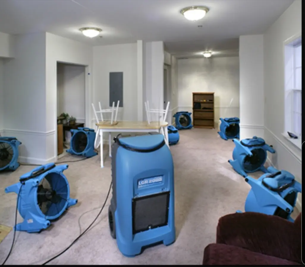 Air movers and dehumidifier setup for Water Damage Restoration in Mango
